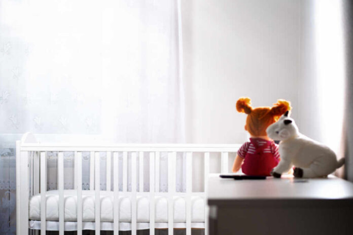 Children's,White,Room,With,An,Empty,Cradle,And,Toys,On