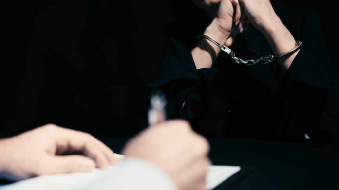 A,Police,Officer,Is,Writing,Down,Information,During,The,Interrogation