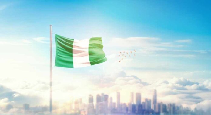 Nigeria,Flag,Wavering,In,Beautiful,Clouds,With,Building,Skyline.,The