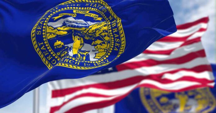 The,Nebraska,State,Flag,Waving,Along,With,The,National,Flag