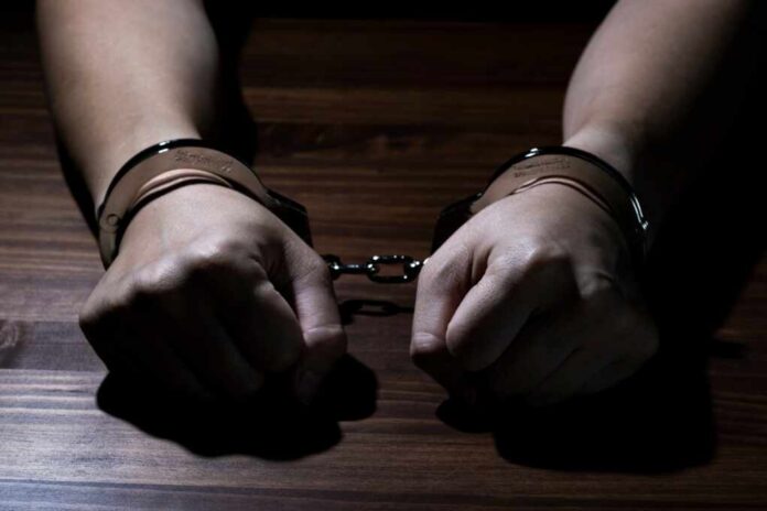 Handcuffed,Male,Hands,In,Restraint