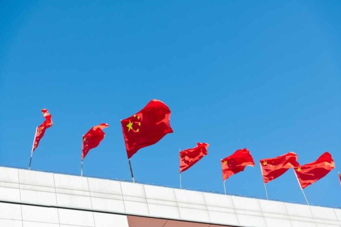 Chinese,National,Flags,Waving,On,Rooftop.