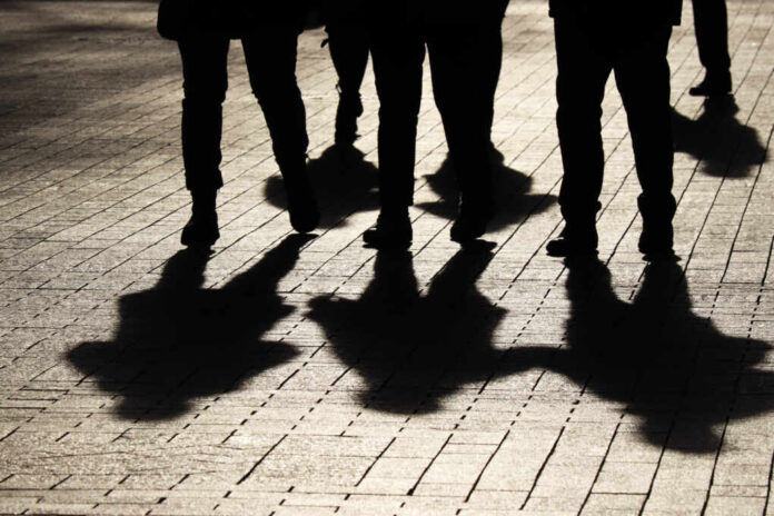 Silhouettes,And,Shadows,Of,People,On,The,Street.,Crowd,Walking