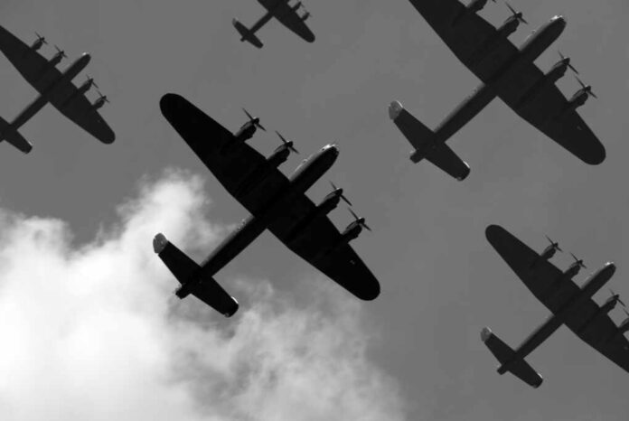 A,Massed,Formation,Of,British,Lancaster,Bombers,Flying,Overhead.