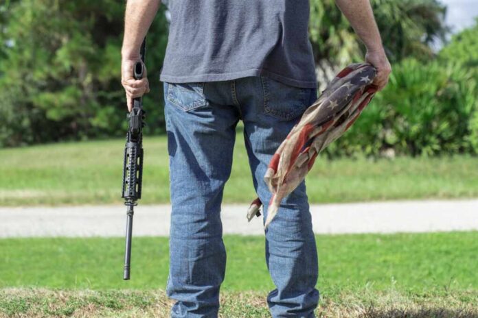 Conservative,Caucasian,Man,Holding,Ar-15,Automatic,Assault,Rifle,And,American