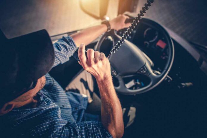 Semi,Truck,Driver,Making,Conversation,With,Other,Truck,Drivers,Through