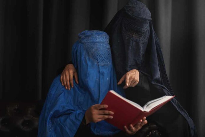 Afghan,Muslim,Women,With,Burka,Traditional,Costume,,Reading,Holy,Quran