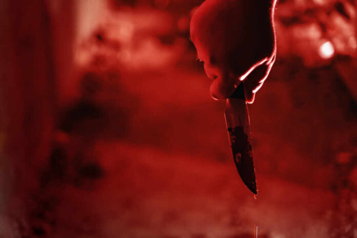 Male,Killer,Hand,Holding,Knife,In,Blood,In,Red,Illuminated