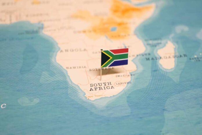 The,Flag,Of,South,Africa,On,The,World,Map.