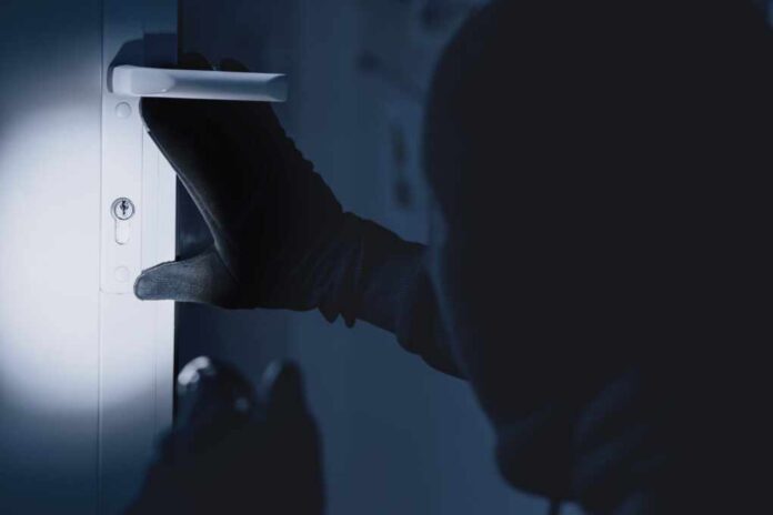 Vandalism,Concept.,Rear,View,Of,Disguised,Burglar,Entering,Enclosed,Property,