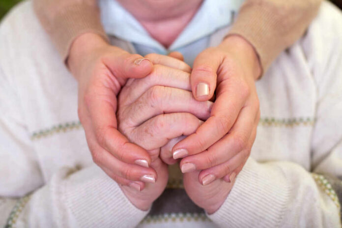Close,Up,Picture,Of,Elderly,Hands,With,Young,Caretaker's,Hands