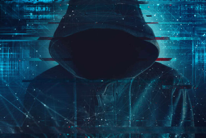 Cybersecurity,,Computer,Hacker,With,Hoodie,And,Obscured,Face,,Computer,Code