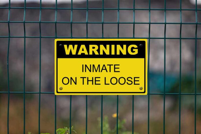 Black,And,Yellow,Warning,Sign,Attached,On,A,Fence.,The