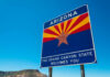Welcome sign for Arizona with a blue sky background