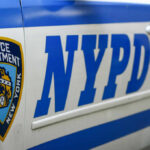 Terror Alert Returns: NYPD Floods Streets Close-up of a New York Police Department vehicle with badge and NYPD lettering