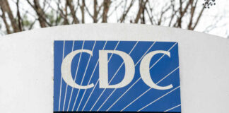 Sign displaying the CDC logo and full name, Centers for Disease Control and Prevention