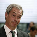 A man with a skeptical expression during a media interaction