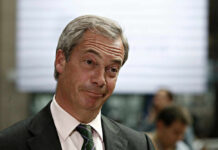 A man with a skeptical expression during a media interaction