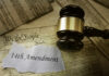 Gavel resting on documents featuring the 14th Amendment