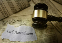 Gavel resting on documents featuring the 14th Amendment