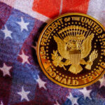 A commemorative coin featuring the presidential seal and the name Donald Trump on an American flag background