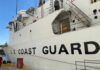 Coast Guard Pay Crisis: Trump Steps In Side view of a U.S. Coast Guard ship docked at a port