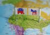 Flags representing the Republican and Democratic parties on a map of the USA