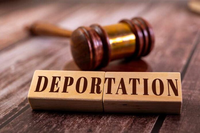 Wooden blocks spelling 'DEPORTATION' next to a gavel