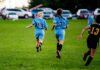 Federal Ultimatum: Universities Funding on the Brink Two girls running on a soccer field during a game