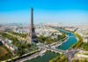 Paris Stays Red: Socialist Grip Remains Aerial view of the Eiffel Tower in Paris with the Seine River and cityscape