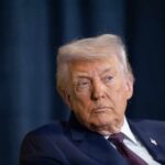 Donald Trump with a serious expression during a media appearance