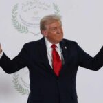 Donald Trump gesturing during a political event