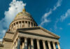 Governor BUSTED Stealing Credit For Billions Close-up view of the dome of the West Virginia State Capitol against a blue sky