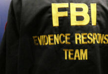 Close-up of an FBI Evidence Response Team jacket with gold lettering