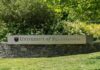 Sign for the University of Pennsylvania surrounded by greenery