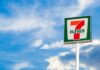 7-Eleven convenience store sign against a blue sky
