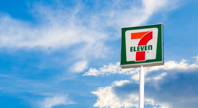shutterstock_2399915865.jpg 7-Eleven convenience store sign against a blue sky