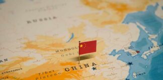 Map of China with a small Chinese flag placed on it