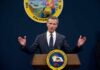 California governor delivering a speech at a podium