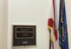 Plaque displaying the name of Representative Sheila Cherfilus-McCormick in a government office