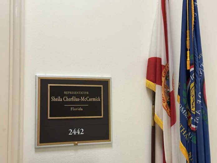 Plaque displaying the name of Representative Sheila Cherfilus-McCormick in a government office