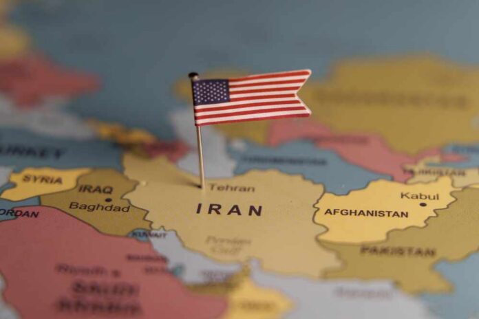 A map highlighting Iran with a small American flag pin