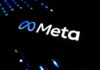 Illuminated Meta logo against a dark background
