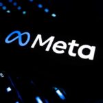 Illuminated Meta logo against a dark background