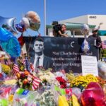 Emotionless Suspect Shocks Judge in Kirk Murder Case A memorial site with flowers, balloons, and a large photo honoring Charlie