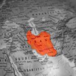 Iran’s Deceptive Strait Deal – Sanctions Demand Exposed Map highlighting Iran in orange on a grayscale background