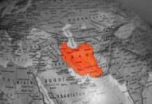 Map highlighting Iran in orange on a grayscale background