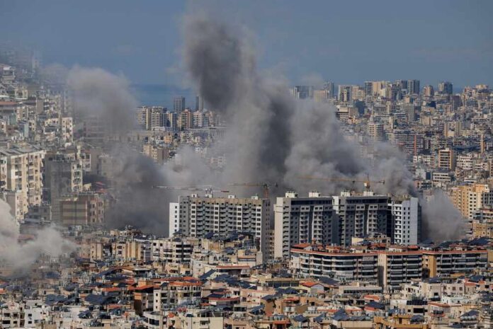 Smoke rising from buildings in a densely populated urban area