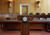 Senator Defects, Ignites War Powers Uproar Wooden podium with the United States Senate seal in an empty Senate chamber