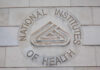 Signage of the National Institutes of Health on a building wall